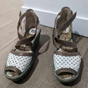 Fly London white leather open toe wedge sandals .